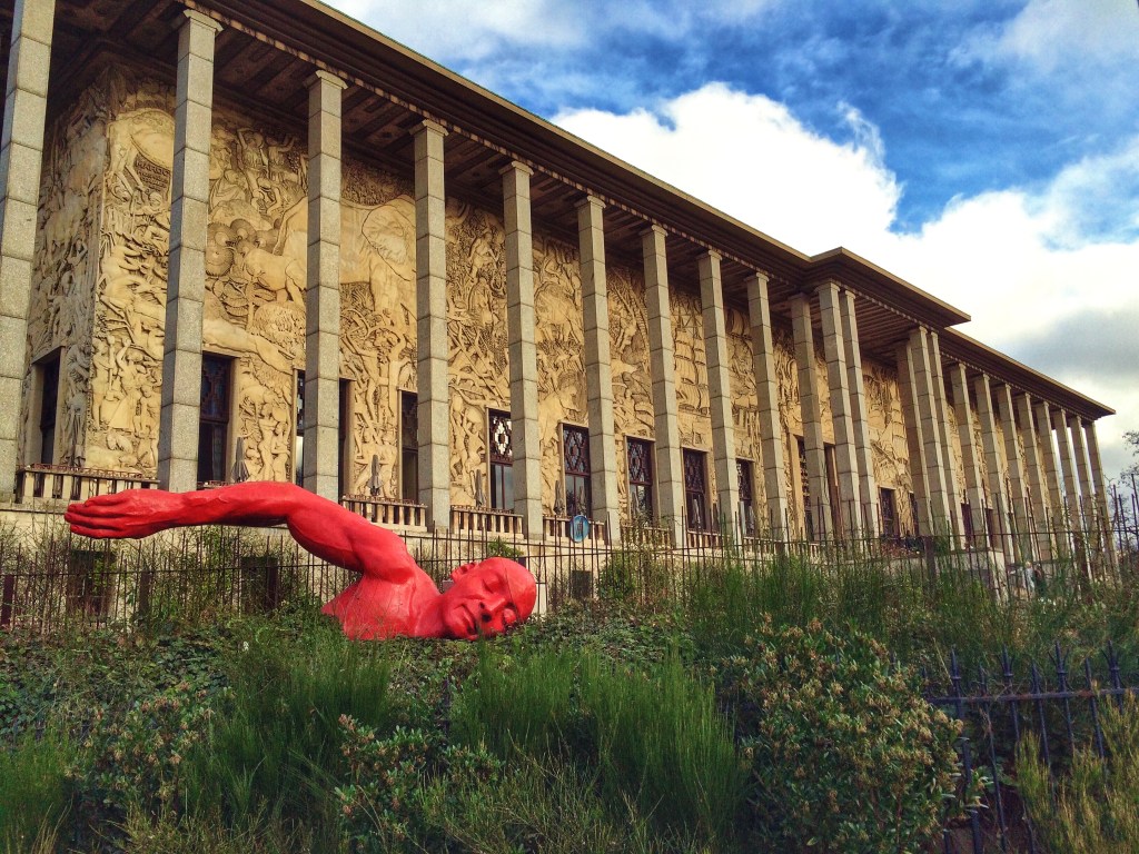 Image of the Museum of the History of Immigration in Paris on a cloudy day.